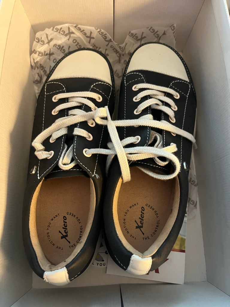 Women’s Black And White Xelero Sneakers